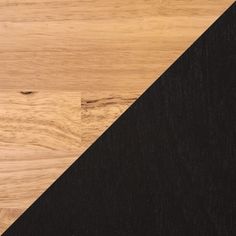 a close up view of a black and wood floor