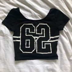 Brand New. Never Worn. Cute Crop And Tight Fitting. Could Fit Xs/S Sporty Black Crop Top T-shirt, Fitted Black T-shirt With Letter Print, Y2k Tops With Letter Print For Night Out, Y2k Letter Print Tops For Night Out, Edgy Stretch Crop Top With Letter Print, Y2k Style Tops With Letter Print For Night Out, Black Y2k Crop Top For Streetwear, Y2k Style Black Crop Top For Streetwear, Edgy Black Crop Top With Letter Print