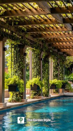 an outdoor swimming pool with plants growing on the walls and above it is a pergolated