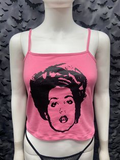 This is a pink X Ray Spex crop tank top with spaghetti straps. This has a X Ray Spex image screen printed on the front. 57% cotton/ 38% polyester/ 5% Spandex These are handmade screenprinted and slightly vary from the photo. Please feel free to email me any questions. Thanks for looking. Due to an influx of incorrect addresses if a package is returned, you must pay the shipping cost to resend the item to you. The seller is not responsible for any lost or stolen packages. Y2k Tank Top For Spring Alternative Fashion, Spring Y2k Tank Top For Alternative Fashion, Y2k Style Tank Top For Spring Alternative Fashion, Edgy Pink Summer Tops, Fitted Pink Tank Top For Streetwear, Trendy Pink Tank Top For Streetwear, Pink Punk Style Summer Tops, Pink Crop Top For Summer Streetwear, Cropped Cotton Top For Alternative Fashion