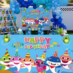 a birthday party with shark balloons and decorations