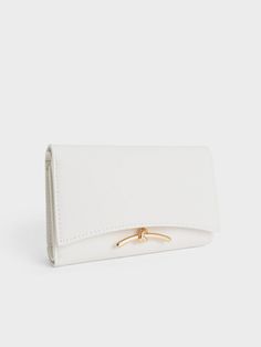 Small in size but big in style, the Huxley front flap wallet in white will help you ace your fashion game while keeping your belongings well-organised. Featuring a sleek curved front flap and knotted gold-toned metallic accent for a chic and sophisticated touch, this accessory is one that you will want to reach for over and over again. Thanks to the push-lock closure and multiple compartments, your belongings are kept safe and secure in this stylish piece. Charles Keith, Metallic Accents, Card Wallet, Fashion Games, In Style, Gold Tones, Wallet, Gold, White