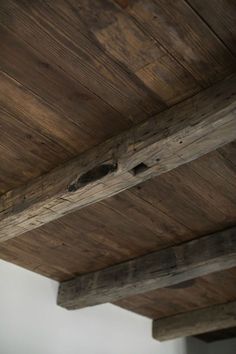 an old wooden ceiling with exposed wood beams