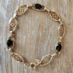 Vintage Gold Filled Fancy Link Onyx Bracelet | Gold-filled Bracelet | Onyx Presenting a gorgeous estate find. What a wonderful bracelet! This is marked for 12k gold filled, Binder Bros. Inc. New York NY. Binders Bros. era is c.1922-1950.   DETAILS: Gemstones: 6x8 mm each x 3 = approx. 3ctw Length of bracelet - approx 7.25"  Stamps: BB 1/2012kGold Filled Condition: Very good commensurate with age. Clasp works well. Your item will arrive beautifully gift-boxed. Layaway is available. Click the tab above for shop policies, or if you are on a mobile device, scroll down in the shop to read our policies and frequently asked questions.  Connect with Us: INSTAGRAM: https://www.instagram.com/cypresscreekvintage FACEBOOK: https://www.facebook.com/CypressCreekVintage PINTEREST: https://www.pinterest.c Onyx Bracelet, Bracelet Gold, Chain Link Bracelet, Link Bracelets, Vintage Gold, Chain Link, Gold Filled, Onyx, Gold Bracelet