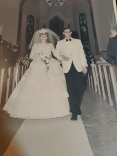 an old photo of a bride and groom walking down the aisle