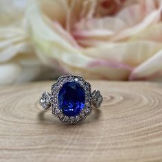 Oval Cut Blue Sapphire Engagement Ring 14k White Gold For Women Unique Vintage Halo Blue Sapphire Promise Ring, Halo Blue Sapphire Ring 6309 #OvalCut #BlueSapphireRing #14kWhiteGold #VintageRings #HaloRings #PromiseRing #BlueSapphire #UniqueRings #ForWomen #EngagementRings Classic Blue Halo Ring, Formal Blue Sapphire Ring Gia Certified, Classic Blue Sapphire Diamond Ring, Blue Tanzanite Diamond Ring With Accent Stones, Blue Cluster Ring With Prong Setting For Anniversary, Classic Blue Rings With Halo Setting, Blue Lab-created Sapphire Diamond Ring With Accent Stones, Classic Blue Halo Ring For Formal Occasions, Classic Royal Blue Round Sapphire Ring