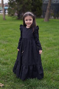 Kids Hijab Dress Almila Model Black Product Features   Fabric Feature: It is made of scalloped cotton fabric. It can be used in 4 seasons. Product Features : It is produced with Almila model festoon cotton fabric. The interior is fully lined with cotton. The front is threaded. Her shoulders are ruffled. It has a hidden zipper on the back. The sleeves are rubber. Note: This product is Black in color. If you are looking for a different color, visit our Etys store.  https://www.etsy.com/shop/Mevlan Kids Eid Dress, Kids New Model Dress, Long Sleeve Solid Dress For Dress-up, Solid Color Long Sleeve Dress For Dress-up, Solid Long Sleeve Dress For Dress-up, Solid Long Sleeve Dresses For Eid, Modest Black Dress For Eid, Black Modest Dress For Eid, Eid Long Sleeve Ruffled Dresses