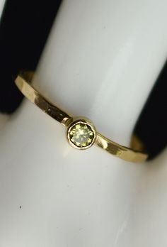 "Grab 5 Hammered 14k Gold Filled stackable mothers rings with birthstones of your choice. Simple, rustic, Everyday Ring. Perfect for a flash of gold and color on the hand, without being to \"much.\" - High quality 14k gold fill bands, and Solid 14k gold bezels. - 3mm Lab grown gemstones. Natural Stones Available. - Delicate hand-hammered texture. - Made to order, just for you. **When you place your order indicate the 5 birth months you want in the note to seller box at checkout.** If you want le Mothers Ring Stackable, Gold Topaz Ring, Birthstone Ring Mothers, Hammered Gold Ring, Womens Rings, Mothers Ring, Measure Ring Size, Birthstone Rings, Mother Rings