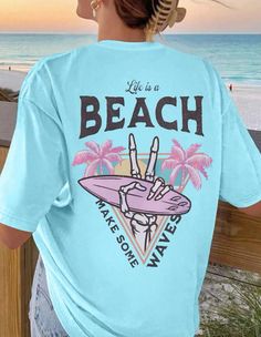 Casual Crew Neck T-shirt For Vacation, Blue Cotton T-shirt For Beach Season, Casual Short Sleeve T-shirt For Beach Season, Blue Summer T-shirt For Surfing, Blue Short Sleeve T-shirt For Beach Season, Casual Blue T-shirt For Beach Party, Blue Beachy T-shirt For Beach, Beachy Blue T-shirt For Beach, Blue Summer T-shirt For Vacation