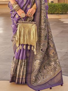 Step into the spotlight with our glamorous purple printed silk wedding wear saree with blouse. This stunning ensemble features a vibrant purple color with intricate printwork and threadwork, making it the perfect choice for weddings, festivals, and other special occasions.
The saree is crafted from high-quality silk fabric, providing a luxurious look and feel. This saree is sure to turn heads and make you feel like a queen at any event.
The elegant design and vibrant color make it a standout cho Purple Pre-draped Saree For Wedding And Eid, Bollywood Style Purple Art Silk Pre-draped Saree, Traditional Purple Pre-draped Saree, Purple Chanderi Pre-draped Saree For Wedding, Festive Purple Pre-draped Saree For Wedding, Bollywood Style Purple Raw Silk Pre-draped Saree, Purple Anarkali Style Pre-draped Saree In Art Silk, Purple Pre-draped Saree With Traditional Pallu, Anarkali-style Pre-draped Saree With Pallu In Purple