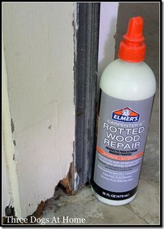 a bottle of wood repair sitting next to a door