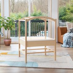 a wooden chair sitting on top of a hard wood floor