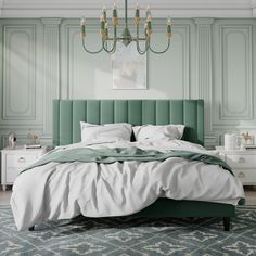 a bed with green headboard and white sheets in a room that has mint green walls