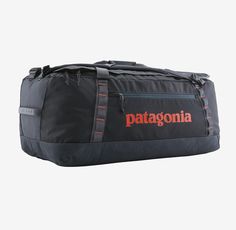 the patagonia duffel bag is shown in black and grey with orange lettering