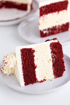 two slices of red velvet cake with white frosting