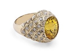 A bezel set oval cut yellow sapphire ring set with round brilliant diamonds in 18K yellow gold. The Gemological Institute of America (GIA) describes this sapphire as Natural with no indications of heating. Metal: 18K Yellow Gold Gemstone: Sapphire: 13.56 carats, GIA Report #2171344178 Luxury Yellow Sapphire Ring, Luxury Yellow Sapphire Round Ring, Luxury Yellow Rings With Rose Cut Diamonds, Luxury Oval Yellow Sapphire Diamond Ring, Oval Yellow Sapphire Diamond Ring Fine Jewelry, Yellow Sapphire Oval Diamond Ring, Oval Yellow Sapphire Ring In Yellow Gold, Luxury Yellow Oval Rings, Oval Yellow Sapphire Diamond Ring