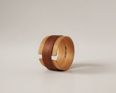 a wooden ring on a white surface