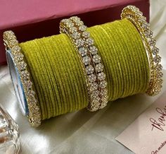 Add a touch of elegance to your wrist with this stunning Fancy Star Bangles Bangles Set. Inspired by the beautiful jewelry of India, this brass bangle set features a unique design with a gold main stone colour that will make you stand out in any crowd. Perfect for women who love to accessorise, this bangle set is a must-have addition to your collection. Crafted with care and attention to detail, this bangle set is perfect for any occasion. The intricate design and the high-quality materials make Gold Fusion Style Bangle For Diwali, Gold Bangle For Diwali Celebration, Gold Fusion Bangle For Diwali, Gold Fusion Bangle For Weddings, Gold Fusion Bangle For Gift, Yellow Gold Bangle With Stone Work For Gifts, Gold Fusion Bangle For Celebration, Festive Yellow Bangle Jewelry, Gold Bollywood Bangle As A Gift