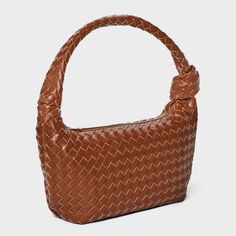 This Slouchy Shoulder Handbag from A New Day™ in brown showcases an unstructured silhouette with a woven-textured construction and a knot detail. It features an interior pocket to help stash away cards, keys or other small items. Plus, it comes with a single strap for convenient carrying, and its zipper closure helps keep items nicely contained. A New Day™: Style that goes wherever you do. Work Tote, Convertible Backpack, Woven Design, Laptop Pocket, Shoulder Handbag, A New Day, Small Items, Shoulder Handbags, Handbag Accessories