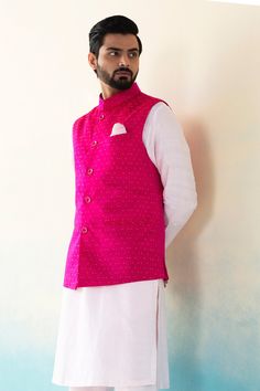 Hot pink handloom katan silk floral woven nehru jacket with golden bootis.
Component: 1
Pattern: Handwoven
Type Of Work: Zari work
Neckline: Band collar
Sleeve Type: Sleeveless
Fabric: Handloom katan silk
Color: Pink
Other Details: 
Welt pockets
Note: Kurta, pant and pocket square worn by the model are not for sale
Occasion: Wedding - Aza Fashions Pink Nehru Jacket For Men, Nehru Jacket For Men, Wedding Kurta For Men, Waistcoat Men, Men's Ethnic Wear, Dress Suits For Men, Nehru Jacket, Nehru Jackets, Katan Silk