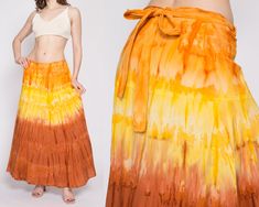 "Beautiful vintage bohemian maxi wrap skirt, in a yellow and orange gradient tie dye cotton, made in India.  Measurements and Condition: Fits like: Labeled free size, but best fits large to XL Fabric: Cotton Brand: Belma, made in India Condition: Very good, with a tiny hole on the front right at the top of the brown dyed section. Length: 38\" Waist: ties down to 33\" Hips: Free Shown on a 5'8\" model with measurements of 34\"-26\"-37\", usually wears a size small. See our FAQ for more info on si A Line Long Skirt, Tye Dye Skirt, Yellow Maxi Skirts, 90s Hippie, Maxi Wrap Skirt, Orange Gradient, Tie Dye Maxi Skirt, Hippie Clothing, Boho Tie Dye