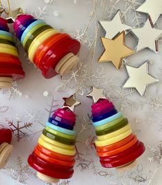 colorful christmas ornaments with stars and snowflakes in the background on a white tablecloth