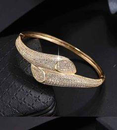 This stunning bracelet is crafted from 18K gold-plated copper for long-lasting shine. Its beautiful cubic zirconia design sparkles elegantly, making it a classy and timeless accessory for any ensemble. Cubic Zirconia Bracelet, Classic Elegant, Timeless Accessories, Bracelet For Women, Elegant Design, Cubic Zirconia, 18k Gold, Gold Plate, Long Lasting