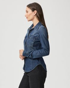 Devika is the classic denim shirt you’ll be reaching for all season long. Crafted from supremely soft denim in a vintage dark blue wash, this lightweight layer is designed with western flare seaming, elevated snap buttons, and double chest pockets. | Devika Shirt - Belinda Blue | Size Small Classic Medium Wash Denim Top, Classic Indigo Denim Top With Relaxed Fit, Classic Indigo Denim Top Relaxed Fit, Classic Indigo Denim Top, Classic Indigo Relaxed Fit Denim Top, Classic Relaxed Fit Medium Wash Denim Top, Classic Dark Wash Denim Top With Button Closure, Classic Washed Blue Denim Top For Workwear, Classic Fitted Denim Top With Pockets