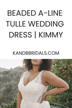 a woman wearing a white wedding dress with the words, beaded - a - line tulle wedding dress kimmy