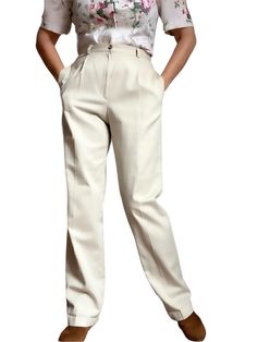 Quality Vintage 80s Highrise classic pleated pants in a light beige tone.  Pleated front, two deep side pockets and attached back pocket. Bootcut style. Fastens with button and front zipper. Perfect with your favorite heels or flats. Or as shown in the picture, with your favorite boots. Classy and sophisticated vintage trousers that will never go out of style.  Best fits M depending on desired drape. Tag reads 100% cotton, Size 12L, Made in USA. Please refer to measurements.  Shown in 5'8", 38-2 Fitted Beige Pleated Bottoms, Classic Cream Tapered Leg Pants, Classic Straight Leg Cream Dress Pants, Classic Cream Straight Leg Dress Pants, Beige Pleated High-waist Bottoms, Beige High-waist Pleated Bottoms, High Waist Pleated Beige Bottoms, Beige Pleated Wide-leg Pants, High-waisted Pleated Beige Bottoms