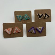 four pairs of beaded triangle earrings