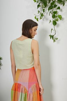 Sleeveless, box crop top with a square neckline and a high back. Such an effortless style, it will easily be your new go-to top for the season. Model 5'7 | Size S 55% Cotton 45% Linen Designed In New York | Handcrafted In India Sizing This garment fits true to size. Questions about the fit? email us at help@rujutasheth.com Click here for sizes corresponding to body measurements *ALL MEASUREMENTS BELOW ARE GARMENT MEASURED ON THE FLAT * Size Chest Length Xs 34” 16” S 36” 16.5” M 38” 17” L 40” 17. Fitted Cotton Crop Top Halter, Fitted Cotton Cropped Hem Tank Top, Cotton Crop Top With Built-in Bra And Spaghetti Straps, Retro Cropped Cotton Tank Top, Cotton Halter Neck Crop Top With Built-in Bra, Boxy Crop Top, Social Impact, Hand Woven Textiles, Lifestyle Shop