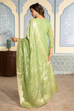 Light green tissue kurta featuring with sequins and mirror work on placket and all-over floral woven motifs. Comes with heavy Banarasi bordered dupatta and matching pant. - Aza Fashions Green Slub Silk Salwar Kameez With Mirror Work, Green Salwar Kameez With Mirror Work In Slub Silk, Green Cotton Silk Churidar With Gota Work, Green Slub Silk Dupatta With Mirror Work, Green Slub Silk Churidar For Transitional Season, Pista Green Tissue Silk Kurta For Diwali, Transitional Green Slub Silk Churidar, Green Traditional Wear With Gota Work In Tissue Silk, Pista Green Slub Silk Churidar For Festivals