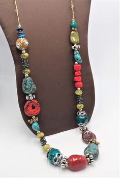 Super fun and colorful, very chunky beads, in colors of burgundy, teal,  yellow, green, red.  Some of the beads have giant bead caps on them. This necklace reminds me of something someone would wear when traveling to south America. Made by Chico's. If you aren't familiar with Chico's they make quality stuff that is functional and will last.  The necklace measures 37 inches long! and has a 4 inch extension chain for just the right fit. The big chunky beads some are 1.25 inches long and an inch wide. Previously owned, so it does have some very slight signs of normal wear. Overall in great vintage pre-owned condition. Thanks so much for looking! If you have any questions or concerns please do not hesitate to reach out to me! I like doing anything I can to help you decide, even if it means not Unique Multicolor Faceted Beads, Colorful Bohemian Faceted Beads, Colorful Bohemian Beaded Necklaces With Large Beads, Colorful Bohemian Large Beaded Necklaces, Unique Multicolor Necklaces With Faceted Beads, Unique Multicolor Necklace With Faceted Beads, Colorful Unique Beaded Necklaces With Large Beads, Bold Multicolor Round Beads Jewelry, Bold Multicolor Round Bead Jewelry