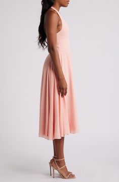 Get ready for garden-party season in a dreamy georgette sundress blooming with a stunning floral print and cut with a back-exposing halter neck. Exclusive retailer Hidden back-zip closure Halter neck Sleeveless, with cutaway shoulders Lined 100% polyester Dry clean Imported Spring Pink Chiffon Bridesmaid Dress, Pink Chiffon Bridesmaid Dress For Spring, Pink Bridesmaid Dress With Flowy Skirt, Pink Chiffon Knee-length Midi Dress, Peach Sleeveless Prom Dress, Summer Wedding Guest Chiffon Midi Dress, Summer Wedding Guest Dress With Flowy Skirt, Pink Chiffon Midi Dress For Prom, Pink Chiffon Midi Dress For Wedding Guest