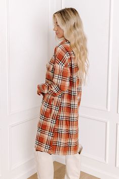 Believe us when we say our pretty rust colored 'Central Park Perks' dress is a fall staple with its lightweight but warm material, black and white plaid print, button down front with a collared neckline, long loose sleeves with button closure cuffs, two accent chest pockets with flap closures, and relaxed silhouette that falls into a straight knee-length hemline! Measurements S : Bust 42", Hip 44", Length 36.5", Sleeve Length 28", Waist 42". M : Bust 44", Hip 46", Length 37", Sleeve Length 28.5" Long Sleeve Brown Plaid Dress For Fall, Plaid Outerwear For Fall Daywear, Rust Long Sleeve Outerwear For Fall, Casual Brown Plaid Dress For Fall, Casual Long Sleeve Plaid Dress For Fall, Casual Button-up Plaid Dress, Long Sleeve Plaid Dress For Daywear, Fall Plaid Dress For Workwear, Long Sleeve Plaid Dress For Fall Daywear