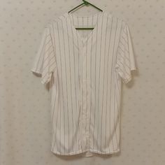 Size Adult Medium. White With Red Pinstripes. Button Down Front. Moisture Management. 100%Polyester. Front Shoulder Seam To Hemline 30" Pit To Pit 22" Sleeve Length 5.5" Back Shoulder Seam To Hemline 32". Washed In Cold Water Hung Dried. Never Worn. Excellent Condition. White V-neck Top With Contrast Stripes, Casual White Baseball Jersey With Contrast Stripes, Casual White Baseball Jersey For Summer, White V-neck Tops With Contrast Stripes, White Cotton Baseball Jersey For Summer, Casual Cotton Baseball Jersey With Three Stripes, Casual Striped Tops For Baseball Season, White Sporty Top With Striped Collar, Back Shoulder