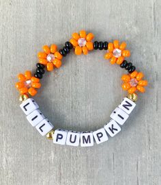 Lil Pumpkin Flower Bracelet 🎃 Perfect little Halloween gift for your lil ghoul 👻 She will love it 🧡 Made with seed beads, bicone beads and 18k gold filled beads ✨✨ CARING TIPS FOR YOUR JEWELRY ⭐️Treat and store with care. ⭐️ For longevity, avoid exposing your jewelry to water. ⭐️ Avoid having direct contact with lotions, perfumes, sanitizers as these chemicals may cause discoloration of your jewelry. Novelty Halloween Jewelry For Friendship, Orange Beaded Bracelets For Halloween Gift, Personalized Halloween Beaded Bracelets, Novelty Beaded Bracelets For Halloween Gift, Customized Beaded Bracelets For Halloween Gift, Personalized Beaded Bracelets For Halloween, Handmade Stretch Bracelet For Halloween, Orange Halloween Gift Bracelet, Halloween Gift Bracelets With Letter Beads