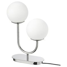 two white balls on a metal stand with one light turned off and the other turned off