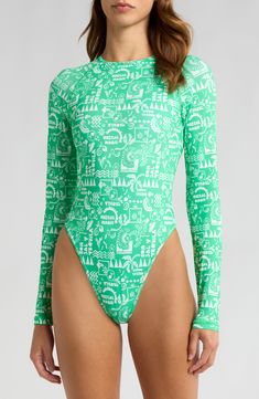 Take a dip in this sleek, long-sleeve one-piece designed with an eye-catching print and a flirty back cutout. Clasps at back Crewneck Long sleeves Cheeky back coverage Lined 84% recycled polyester, 16% elastane Hand wash, dry flat Imported Green Long Sleeve Swimwear For Poolside, Green Long Sleeve Swimwear For Beach, Green Long Sleeve Beachwear Swimwear, Fitted Long Sleeve Green Swimwear, Green Stretch Bodysuit For Surfing, Green Long Sleeve Bodysuit For Beach, Green Bodysuit For Surfing, Spring Green Long Sleeve Swimwear, Green Long Sleeve Bodysuit For The Beach