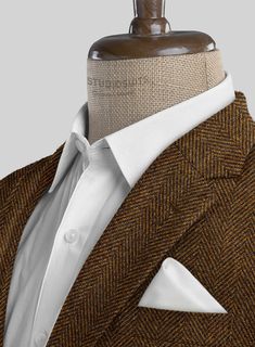 Venture into the essence of refined distinction with our Italian Highlander Mustard Herringbone Tweed Suit. Crafted from sumptuous wool, this masterpiece radiates with a vibrant mustard color, intricately woven with a striking black herringbone pattern that captivates and charms. It's not just attire; it's a declaration of style offering warmth and a luxurious texture that speaks volumes of its superior quality. Ideal for autumnal gatherings, prestigious business encounters or momentous celebrat Brown Wool Suit With Herringbone Pattern, Brown Tweed Suit With Herringbone Pattern, Brown Tweed Jacket With Herringbone Pattern And Suit Collar, Brown Tweed Jacket With Herringbone Pattern, Luxury Herringbone Tweed Jacket For Tailoring, Brown Fitted Herringbone Suit, Fitted Brown Herringbone Suit, Fitted Brown Suits With Herringbone Pattern, Elegant Brown Tweed Jacket With Herringbone Pattern