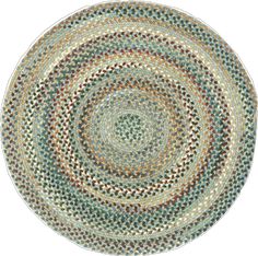 an oval rug with multicolored circles in the center on a white background,