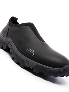 Bkack leather Dirt Moc slip-on sneakers from A-COLD-WALL* featuring slip-on style, round toe, logo print to the side, pull-tab at the heel and chunky rubber sole. A Cold Wall, Pull Tab, Brunello Cucinelli, Leather Slip Ons, Rick Owens, Slip On Sneakers, Sneakers Black, Shoe Collection, Logo Print