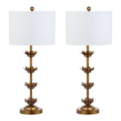 a pair of brass leaf lamps with white shades on each lamp and the same shade