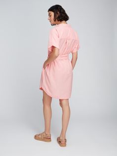 Is it a shirt or is it a dress? How about the best of both! The Diantha Shirt Dress has shape and silhouette of a shirt, but with the additional length of a dress. Great worn alone as a cover up on the beach, or with jeans or shorts – it's superbly versatile. Crafted with 100% BCI cotton, which means it's made with higher cotton farming standards, this pink stripe material is as ethical as it is pretty. Casual Fitted Shirt Dress For Beach, Feminine Cotton Shirt Dress For Day Out, Cotton Summer Shirt Dress For Day Out, Summer Cotton Collared Dress, Summer Collared Shirt Dress For Day Out, Summer Cotton Shirt Dress For Day Out, Daywear Mini Dress With Tie Waist, Casual Fitted Shirt Dress For Vacation, Spring Shirt Dress With Tie Waist And Relaxed Fit