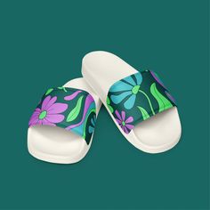 Step into comfort and style with these women's slides, perfect for the Phish festival or any casual occasion. Featuring a vibrant retro floral pattern in mondegreen colors, these slides are designed to offer both comfort and a touch of whimsy. Ideal for Phish fans who want to showcase their style while enjoying their favorite music. Lightweight and versatile, these slides are a must-have for any festival-goer or anyone who loves unique, eye-catching footwear. * Cushioned and durable faux leather Comfortable Green Slide Slippers, Casual Green Slip-on Slides, Green Comfortable Flat Flip Flops, Comfortable Green Flat Flip Flops, Green Casual Slip-on Flip Flops, Casual Green Slip-on Flip Flops, Comfortable Green Open Toe Slides, Multicolor Slip-on Slides For Summer, Comfortable Multicolor Slippers For Spring