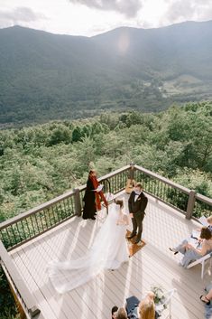 the bride and groom are getting ready to walk down the aisle at their outdoor wedding ceremony