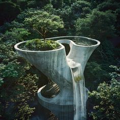 an unusual building in the middle of trees with water flowing down it's sides