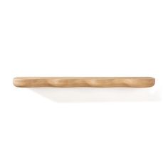 a wooden toothbrush on a white background