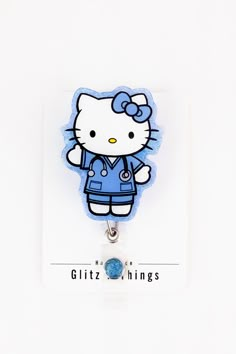 a hello kitty keychain with an embellishment on it's front